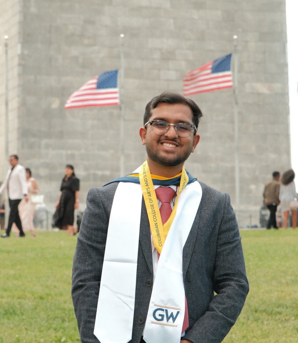 Pramod Krishnachari at commencement on the National Mall, wearing a George Washington University stole